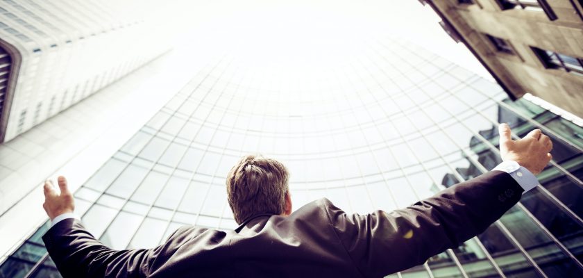 man in the middle of buildings